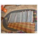 47x61 oval braided rug, two woven rugs and a table runner
