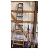 Long handled yard tools and 10’ wooden ladder as shown