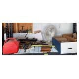 On shelf includes gas can, stemware, fan, yardstick, wiffle bat, etc