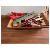 Rectangular wooden bowl with Lincoln Logs and alphabet blocks