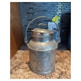 Metal creamer pail marked “Liquid 4qt”