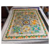Machine stitched and custom quilted measures 52x67