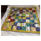 Machine stitched and custom quilted measures 53x53