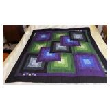 Machine stitched and custom quilted measures 54x56