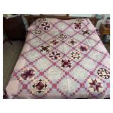 Machine stitched and custom quilted 92x96