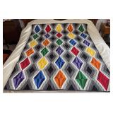 Machine stitched and custom quilted measures 68x56