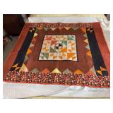Machine stitched and custom quilted measures 54x64