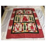 Machine stitched and custom quilted measures 35x54