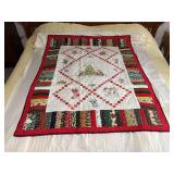 Machine stitched and custom quilted measures 55x44