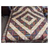 Machine stitched and custom quilted 96x80 “Log Cabin”