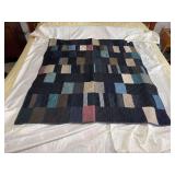 Machine stitched and custom quilted measures 45x50 Flannel back