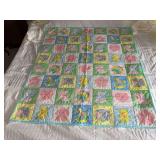 Machine stitched and custom quilted measures 43x48