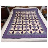 Machine stitched and custom quilted measures 57x70