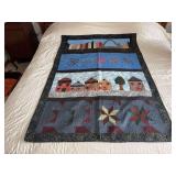 Machine stitched and custom quilted measures 44x62