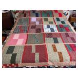 Machine stitched and custom quilted measures 81x67, flannel blocks