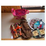 Gift basket w wine bag, napkins, oven mitts, hot pads/trivets
