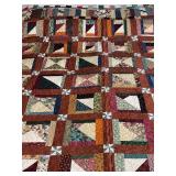 Machine stitched and custom quilted measures 67x72