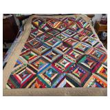 Machine stitched and custom quilted measures 69x85