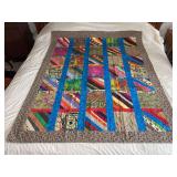 Machine stitched and custom quilted measures 52x64
