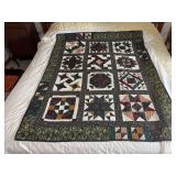 Machine stitched and custom quilted measures 50x63