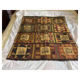 Machine stitched and custom quilted measures Machine embroidered blocks