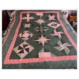 Machine stitched and custom quilted measures 77x61