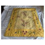 Machine stitched and custom quilted measures 35x47