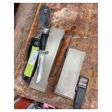 Buck 119 knife with sheath has broken handle and two sharpening stones