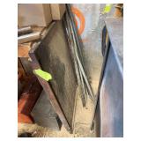 Heavy duty, metal welding table top and some pieces of pipe miscellaneous, plus miscellaneous steel, and metal pieces around the shop