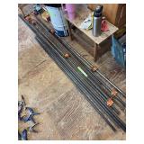 Four adjustable pipe clamps and six extra pieces of pipe