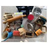 Miscellaneous collectibles, including wooden train, rolling pin, dresser items, Dazey butter churn, flour sifter, vintage tins, door hardware