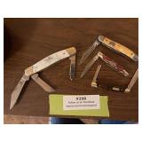 Four pocket knives, including imperial, sharp, buck and Mossey Oak
