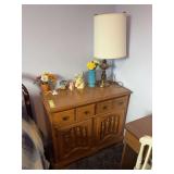 Hard rock maple sideboard cupboard with lamp and some decorative pieces