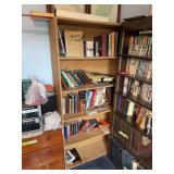 Light wood particle board bookshelf, and all reading material