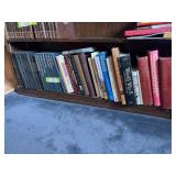 Shelf full of aircraft/war/military type books