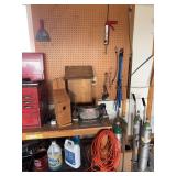 Tool bench, bench grinder, birdhouse, spud box and items on pegboard