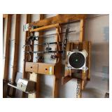 Gun rack with fishing poles, shooting target, tacklebox