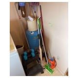 Stepstool, 5 pound dumbbells, broom, swiffer, grabber and a few cleaning supplies in the laundry cupboards