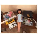 Vintage toy items includes tin tea set, doll and doll clothing, small camera
