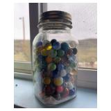 Glass canning jar full of marbles