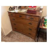 Four drawer chest of drawers - solid wood, and eight drawer particleboard dresser