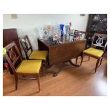 Antique Duncan Phyfe style clawfoot dining room table with double drop leaf and two removable leaves, plus 4 lyre back chairs