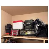 Assortment of coolers and duffel bag