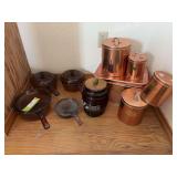 Four lidded glass vision wear pots, copper looking canister set and cookie jar