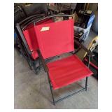 Four red mesh fold up patio chairs