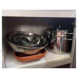 Double boiler, colanders, large mixing bowl, bundt pan and glass baking dishes