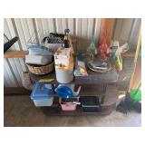 Household storage shelf, some kitchen items, french fry cutter, plastic margarita glasses, and two black shelving units with household items