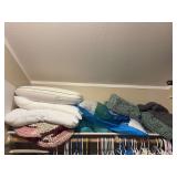 Assortment of pillows and bathroom rugs