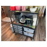 Rolling storage rack with some towels and hot pads