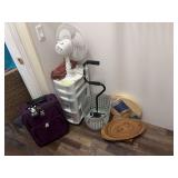 Oscillating fan, small hamper, cane, small suitcase, storage caddy